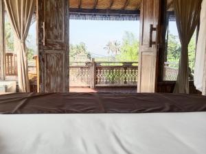 Balkón nebo terasa v ubytování Ananda JJ Ubud Resort & Spa