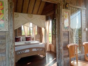 Postel nebo postele na pokoji v ubytování Ananda JJ Ubud Resort & Spa