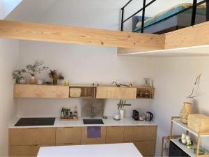 a kitchen with a sink and a bunk bed at Cottage in Svencele in Svencelė