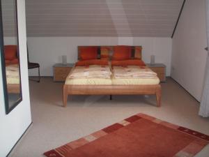 Кровать или кровати в номере Ferienhaus am Ternscher See