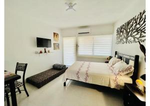 Llit o llits en una habitació de CasaBlanca Grand, la mejor vista de Acapulco