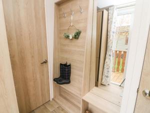 a door with a boot next to a window at Langdale Lodge in Carnforth +13 photos