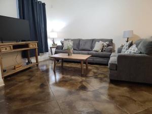 a living room with a couch and a coffee table at Chateau 15 in Hammond