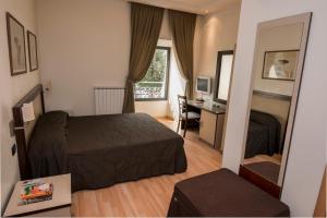 A bed or beds in a room at My Rooms