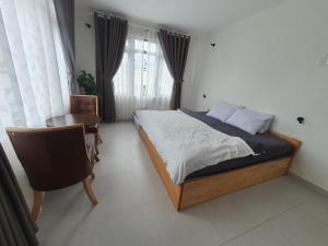 Postel nebo postele na pokoji v ubytování Hello Dalat Hostel
