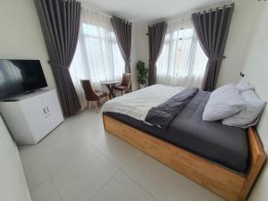 Postel nebo postele na pokoji v ubytování Hello Dalat Hostel