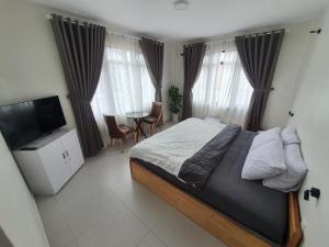 Postel nebo postele na pokoji v ubytování Hello Dalat Hostel