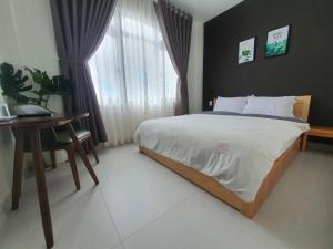 Postel nebo postele na pokoji v ubytování Hello Dalat Hostel