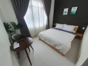 Postel nebo postele na pokoji v ubytování Hello Dalat Hostel