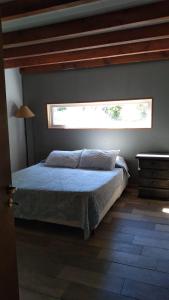Ένα ή περισσότερα κρεβάτια σε δωμάτιο στο Casa de montaña