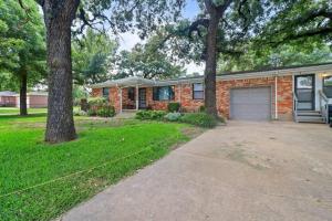 a brick house with a garage and a tree at Summer Deal! Texas Rival Home in Fort Worth near Keller, Globe Life, AT&T in Fort Worth