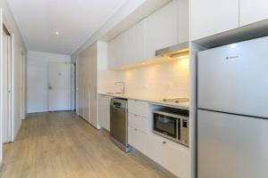 A kitchen or kitchenette at Peppers Salt Resort & Spa - Lagoon pool access 2 br spa suite