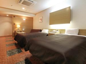 מיטה או מיטות בחדר ב-Hotel San Marco
