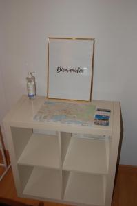 a white table with a map on top of it at Amplio estudio en centro y playa Victoria 13 in Málaga