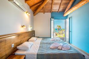 Ένα ή περισσότερα κρεβάτια σε δωμάτιο στο Mirage Arillas Maisonette B
