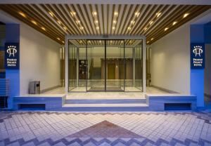 a lobby with a large glass door in a building at Pharae Palace in Kalamata