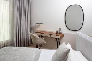 Posteľ alebo postele v izbe v ubytovaní hirschen dornbirn - das boutiquestyle hotel - skyrelax & wellness im rooftop