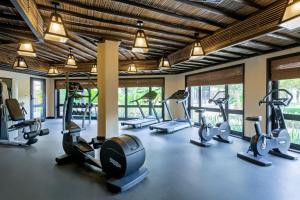 a gym with several treadmills and elliptical machines at Atana Musandam Resort in Khasab