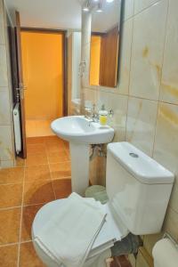 a bathroom with a toilet and a sink at Naiades Summer House I in Plátanos +22 photos
