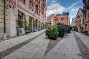an empty street in a city with buildings at Right House via Sulis 23 - Best Neighborhood in Town in Cagliari