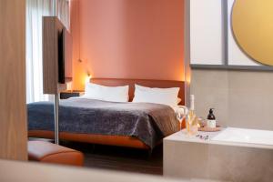 Posteľ alebo postele v izbe v ubytovaní hirschen dornbirn - das boutiquestyle hotel - skyrelax & wellness im rooftop