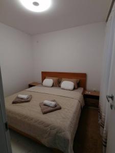 מיטה או מיטות בחדר ב-Vila Slavica