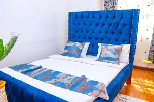 Postel nebo postele na pokoji v ubytování Stay.Plus Embakasi Airport Apartment