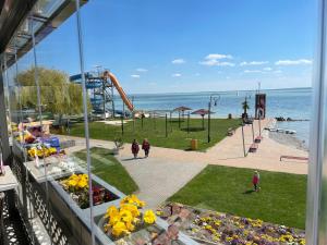 a view of a park with a roller coaster at Luxus Apartment direkt am See in Csopak