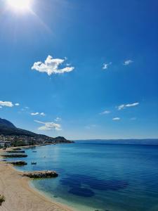 a view of a beach with boats in the water at Luxury lifestyle apartment in Podstrana