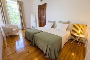 Postel nebo postele na pokoji v ubytování 3 Marias Residence + 37 fotografií