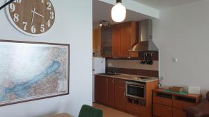 A kitchen or kitchenette at Golden Brown Apartment