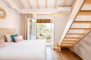 Ένα ή περισσότερα κρεβάτια σε δωμάτιο στο KORINA APART HOTEL KAVOS