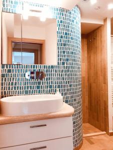 a bathroom with a sink and a mirror at A casa dei Sasso vista mare mozzafiato in Positano +15 photos