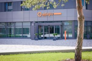 an office building with a sign that reads auditorium at Adagio Access Stuttgart Airport Messe in Leinfelden-Echterdingen