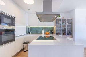 A kitchen or kitchenette at SEA VIEW 2 BDR Apartment Allonbay Village & SPA