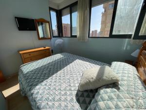 A bed or beds in a room at Apartamento Kennedy 2 by Gestaltur