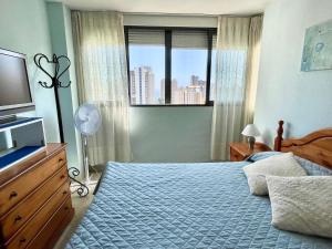 A bed or beds in a room at Apartamento Kennedy 2 by Gestaltur Még 8 kép