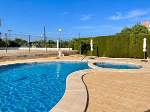 The swimming pool at or close to Apartamento Kennedy 2 by Gestaltur