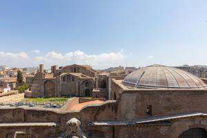 a view of a city with a building and a dome at Amazing Via Parigi in Rome