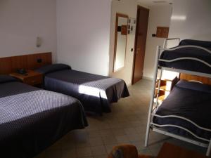 Postel nebo postele na pokoji v ubytování Hotel Rezia + 37 fotografií