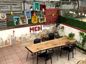 a table and chairs in front of a wall at Medi Otel in Samsun +28 photos