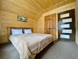 Postel nebo postele na pokoji v ubytování Chalet Зоряні ночі