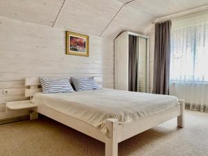 Postel nebo postele na pokoji v ubytování Chalet Зоряні ночі