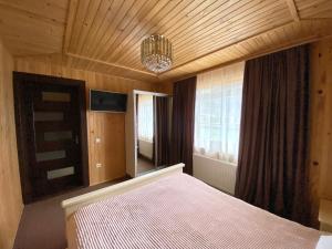 Postel nebo postele na pokoji v ubytování Chalet Зоряні ночі