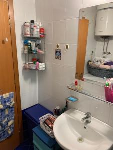 a bathroom with a sink and a mirror at Guest House Mudresa in Budva +31 photos