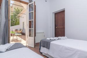 Un pat sau paturi într-o cameră la Villa El Terreno