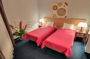Posteľ alebo postele v izbe v ubytovaní Hotel Petrus