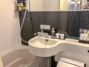 Bilik mandi di HOTEL LiVEMAX BUDGET Nagoya Taikodori