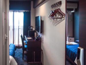 Łóżko lub łóżka w pokoju w obiekcie HOTEL LiVEMAX BUDGET Nagoya Taikodori
