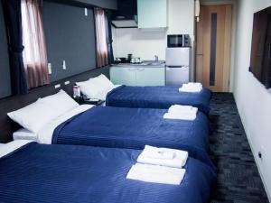 Katil atau katil-katil dalam bilik di HOTEL LiVEMAX BUDGET Nagoya Taikodori
